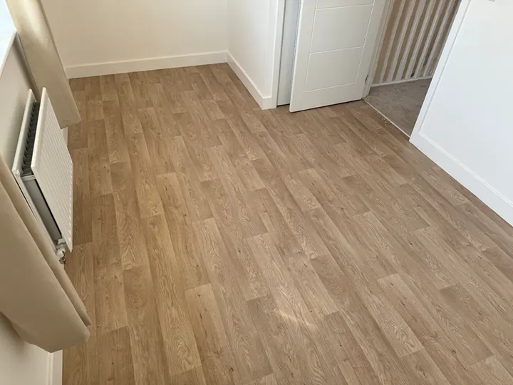 A completed luxury vinyl tile flooring installation